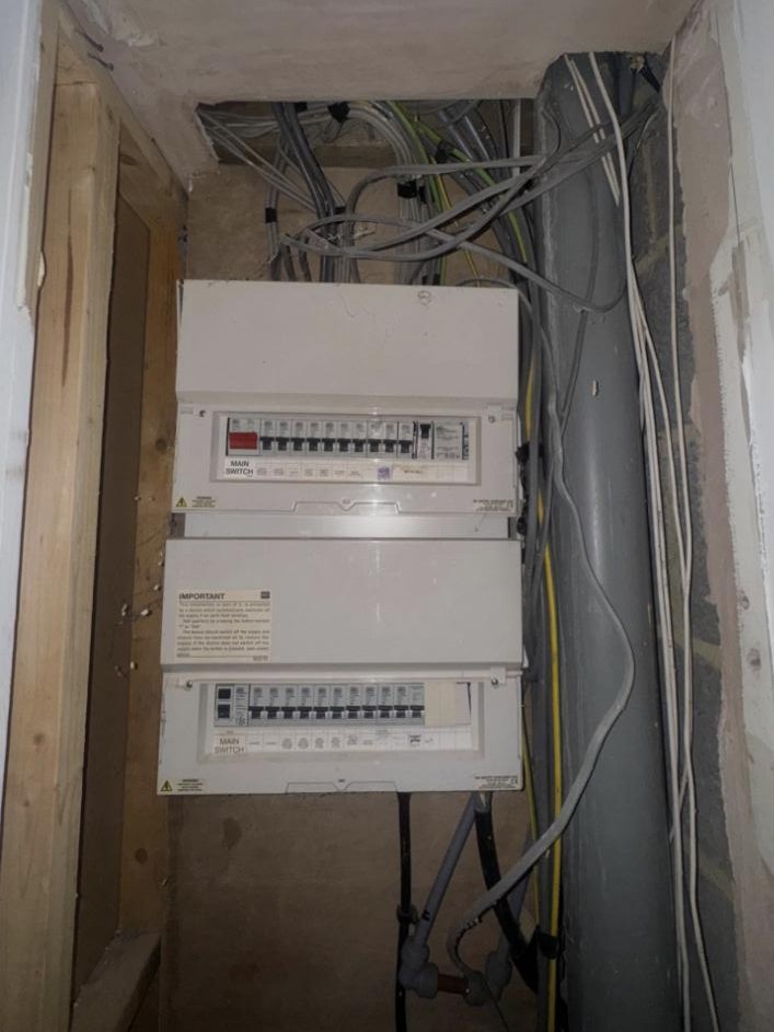 Before: original boards and wiring by Excel Electrical in Bedford