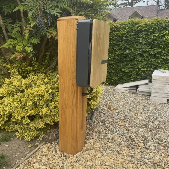 EV charger on a bespoke oak post by Excel Electrical